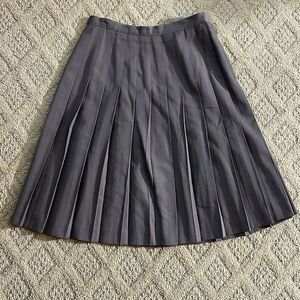 Brown pleated skirt with side zip. Size 10